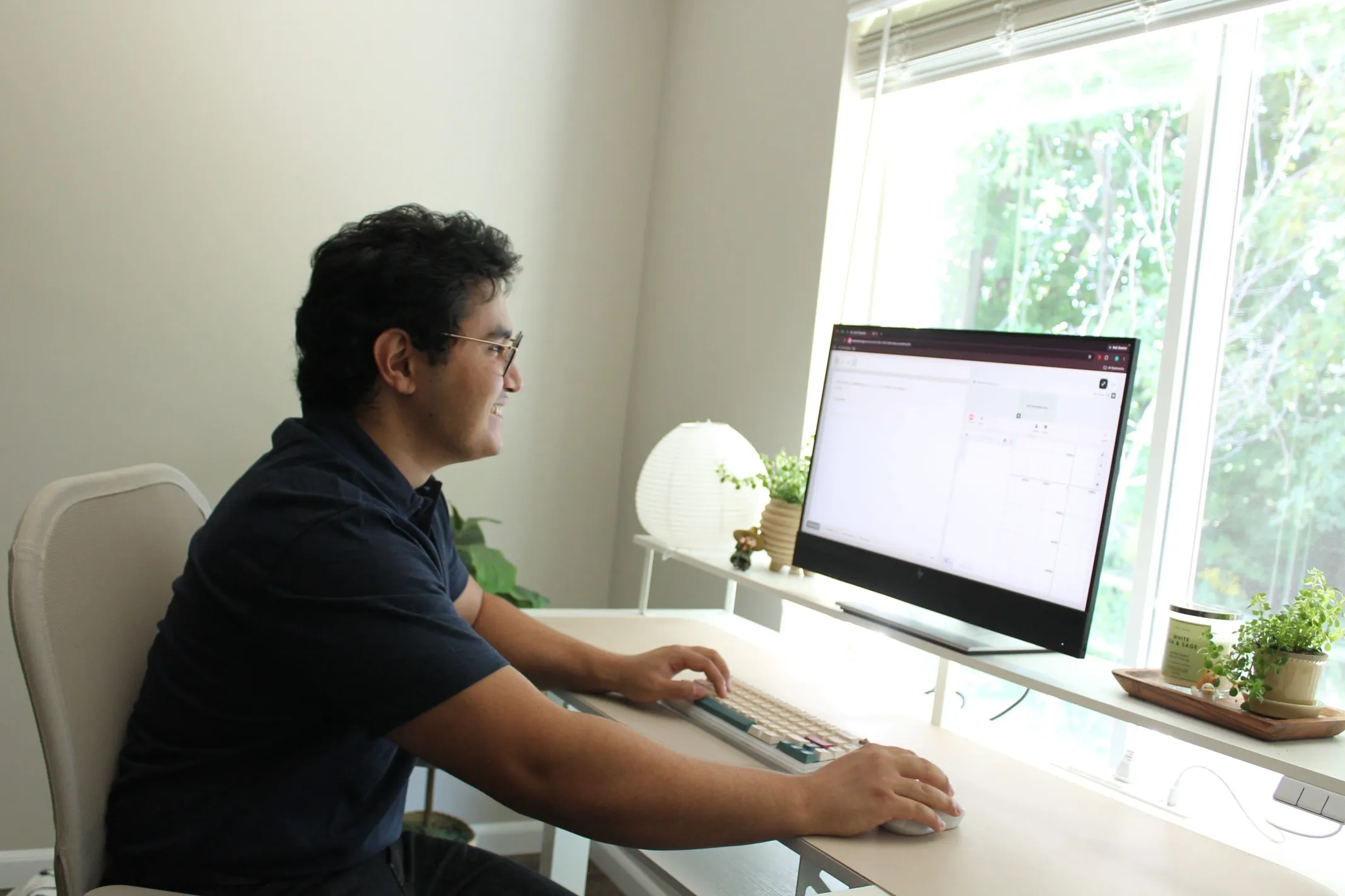 Amir at his desk, working through a question on the practice site
